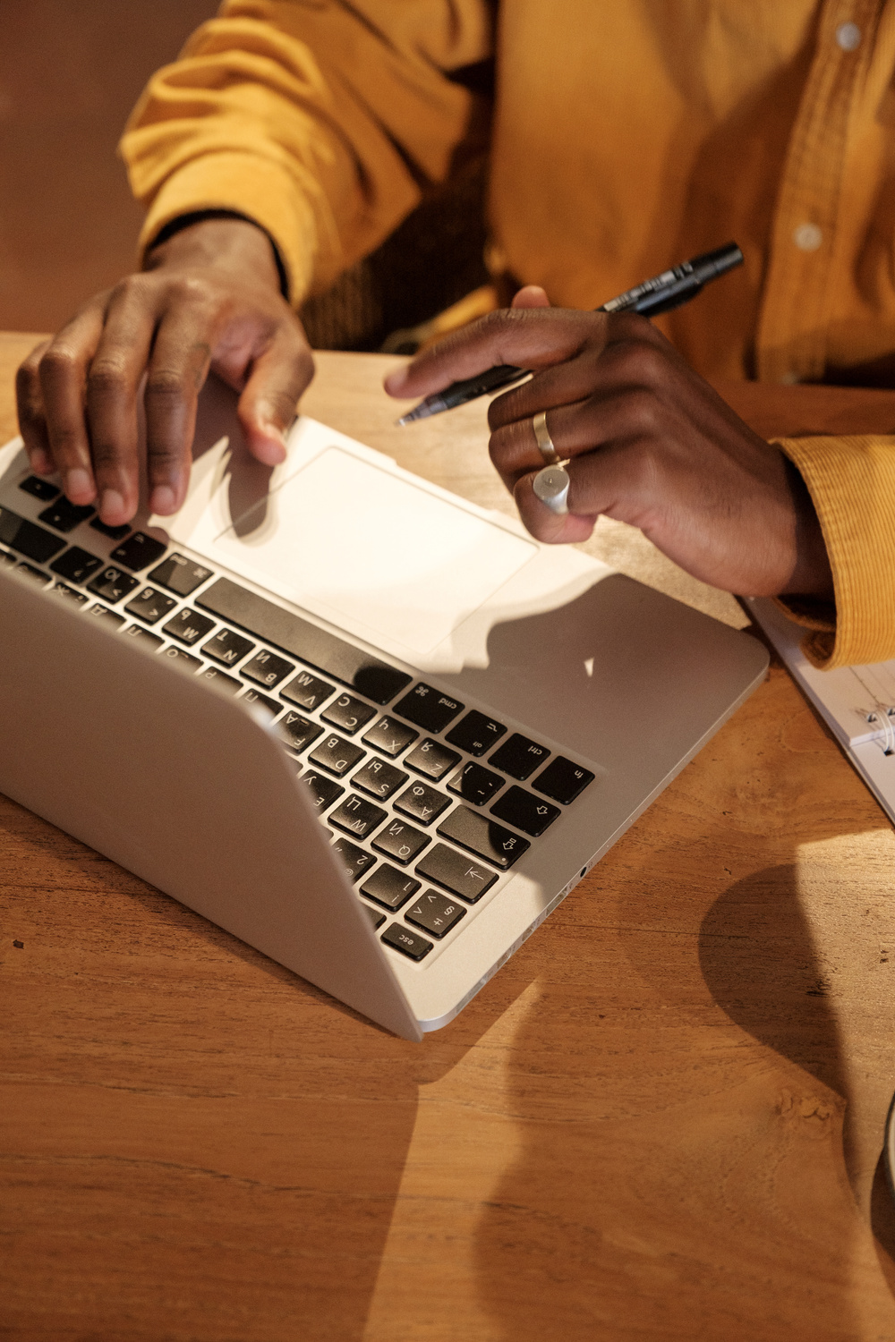 Male Podcaster Using a Laptop